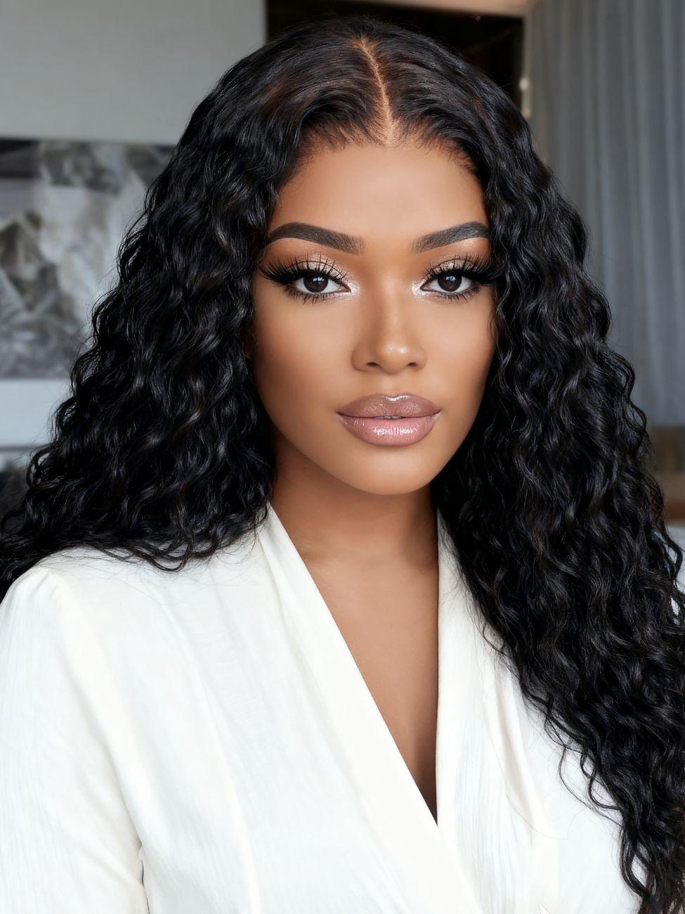 A model displays the UNice Bye Bye Knots 7x5 Lace Mixed Curls Wig with Invisi Drawstring, showing a model with long black hair wearing a white shirt and 7x5, lace.