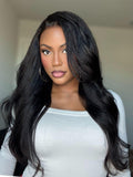 A model displays the UNice 13x4 Glueless Lace Front Collection Wig Virgin Human Hair Kinky Straight Wig, showing a model with long black hair and a white shirt and kinky.
