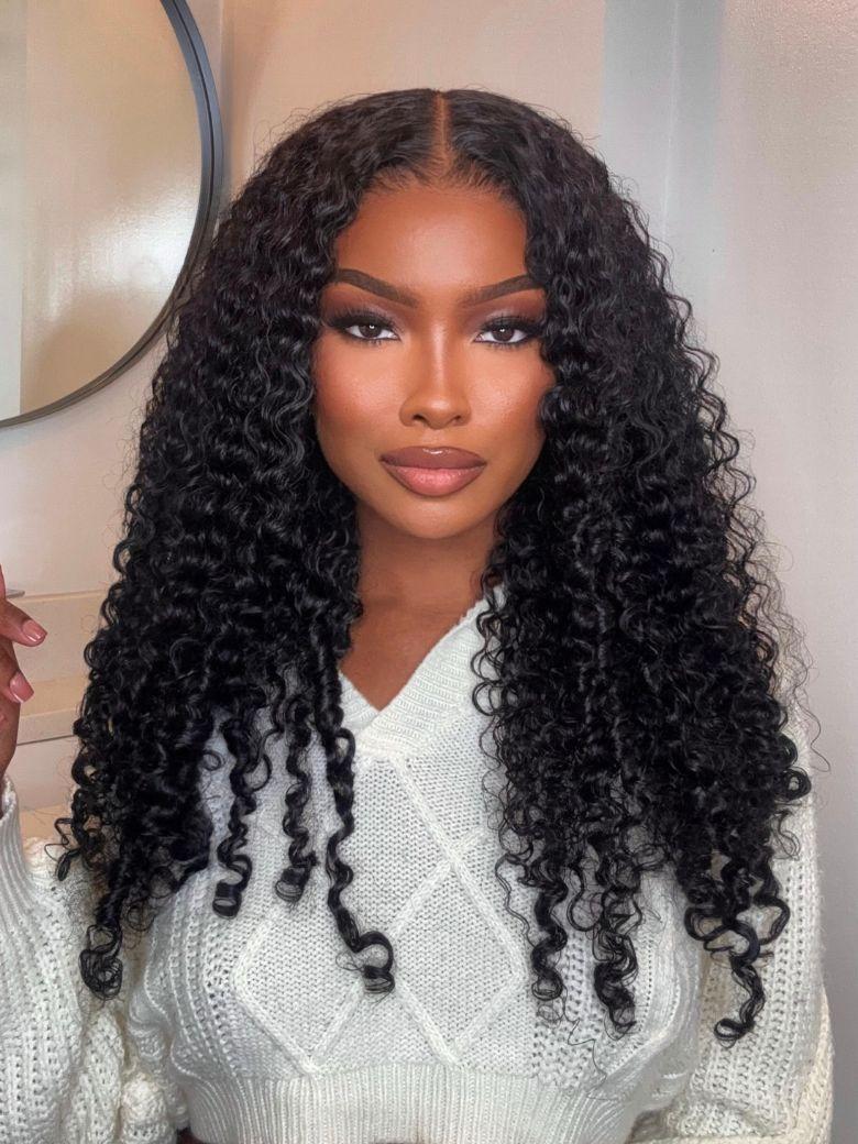 A model displays the UNice Ship within 24H UNice Bye Bye Knots 7x5 Lace Pre-Everything Curly Texture wig, showing a model with long curly hair wearing a white sweater.