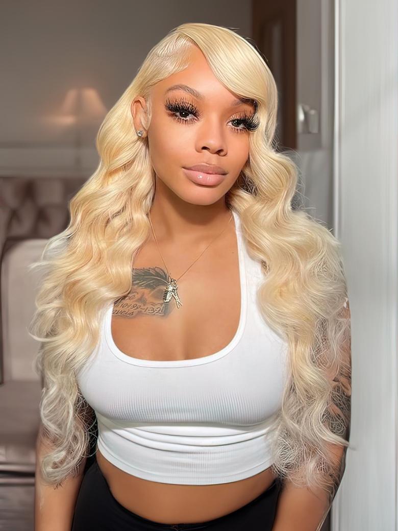 A model displays the UNice Hair 613 Blonde Virgin Human Hair Wave 4 Bundles Body Wave Hair Weft, showing nicki wigs blonde blonde wigs with bangs and body wave texture.