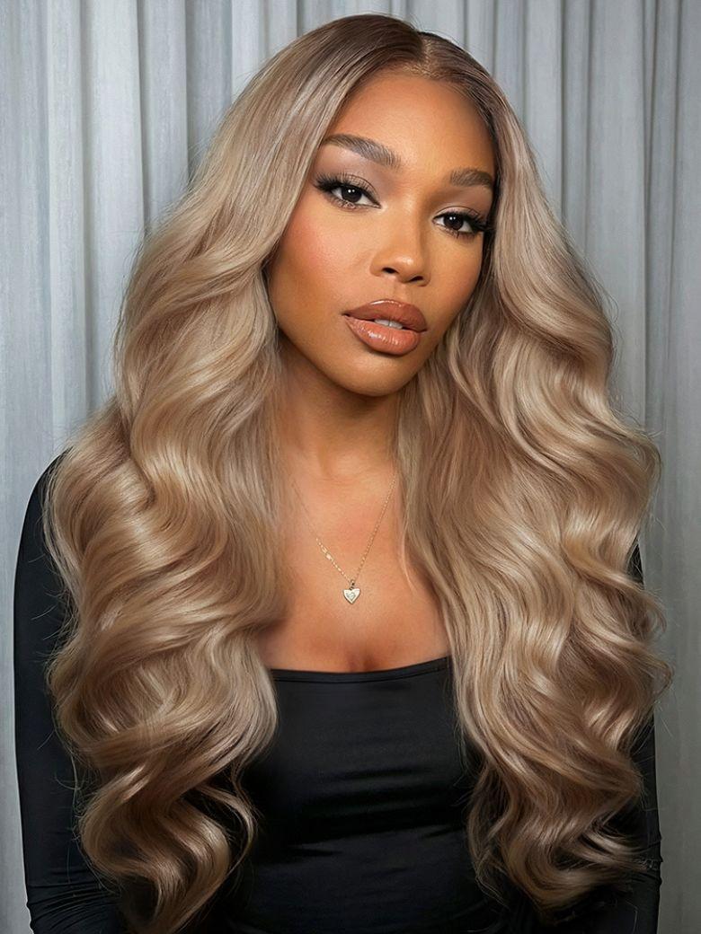 A model displays the UNice Ash Blonde With Brown Roots No Slip 13x4 Pre-Everything Lace Frontal Body Wave, showing a model with long blonde hair wearing a black top.