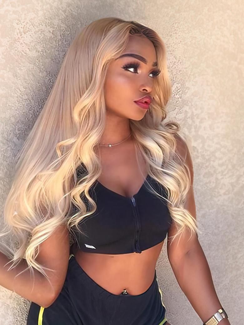 A model displays the UNice Hair 613 Blonde Body Wave Hair 13x4 Lace Frontal, showing a woman in a black top and neon green shorts and body wave texture, 613 blonde, 13x4.