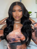 Body wave glueless lace wig featuring a sleek middle part and long, voluminous black curls styled on @NauteyaWhyee.