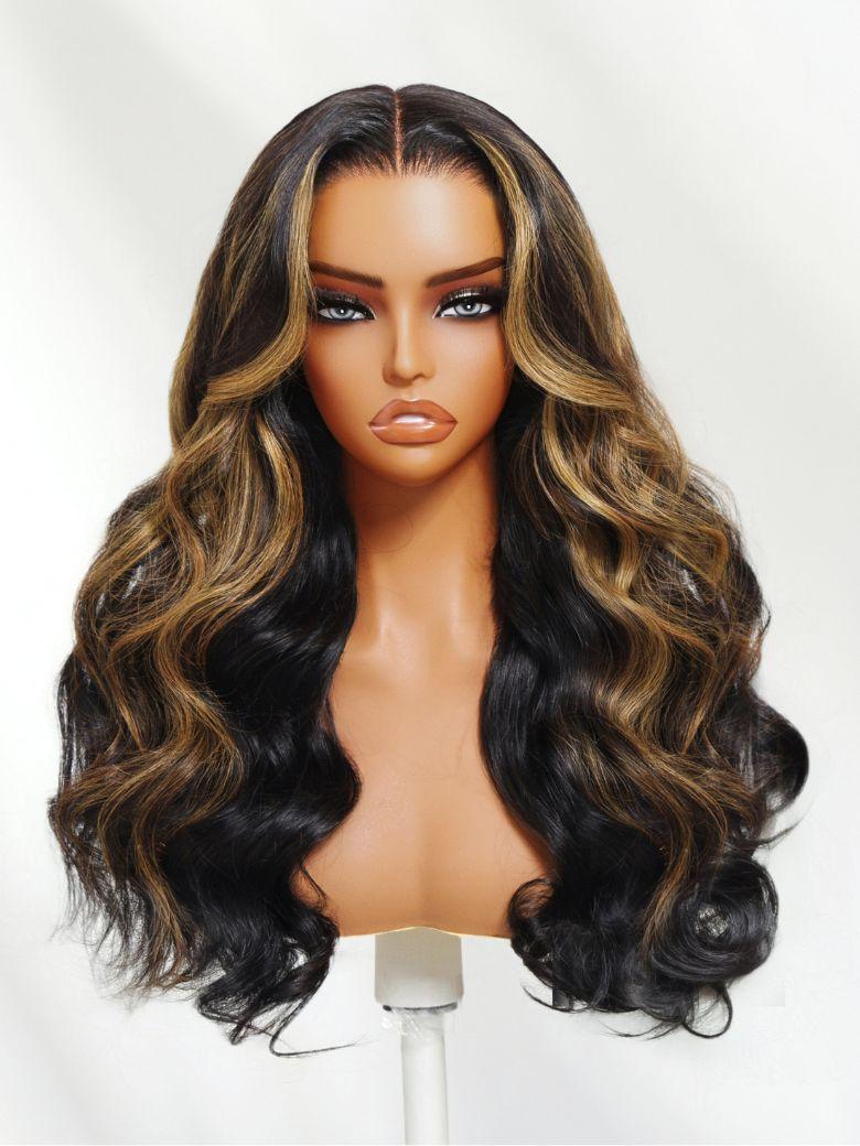 The UNice 13X6 Balayage Highlight& 7x5 Bye Bye Knots Black with Caramel Blonde wig image highlights UD, a wig with long wavy hair and brown and black highlights and body.