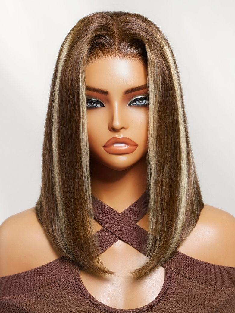 A model displays the UNice 7x5 Bye Bye Slip Lace Glueless Brown with Blonde Skunk Stripe Straight Bob Wig, showing a model with long brown hair and brown eyes.