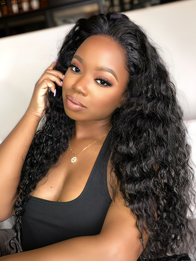 A model displays the UNice Undetectable HD Lace 5x5 Closure with 3 Deep Wave Bundles, showing a woman sitting on a couch with a cell and deep wave texture, 5x5, lace.