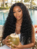 A model displays the UNice 13x4 Bye Bye Slip Lace Frontal Soft Water Wave Glueless Wig with Fluffy Loose, showing a woman holding a coconut and a drink and water wave.