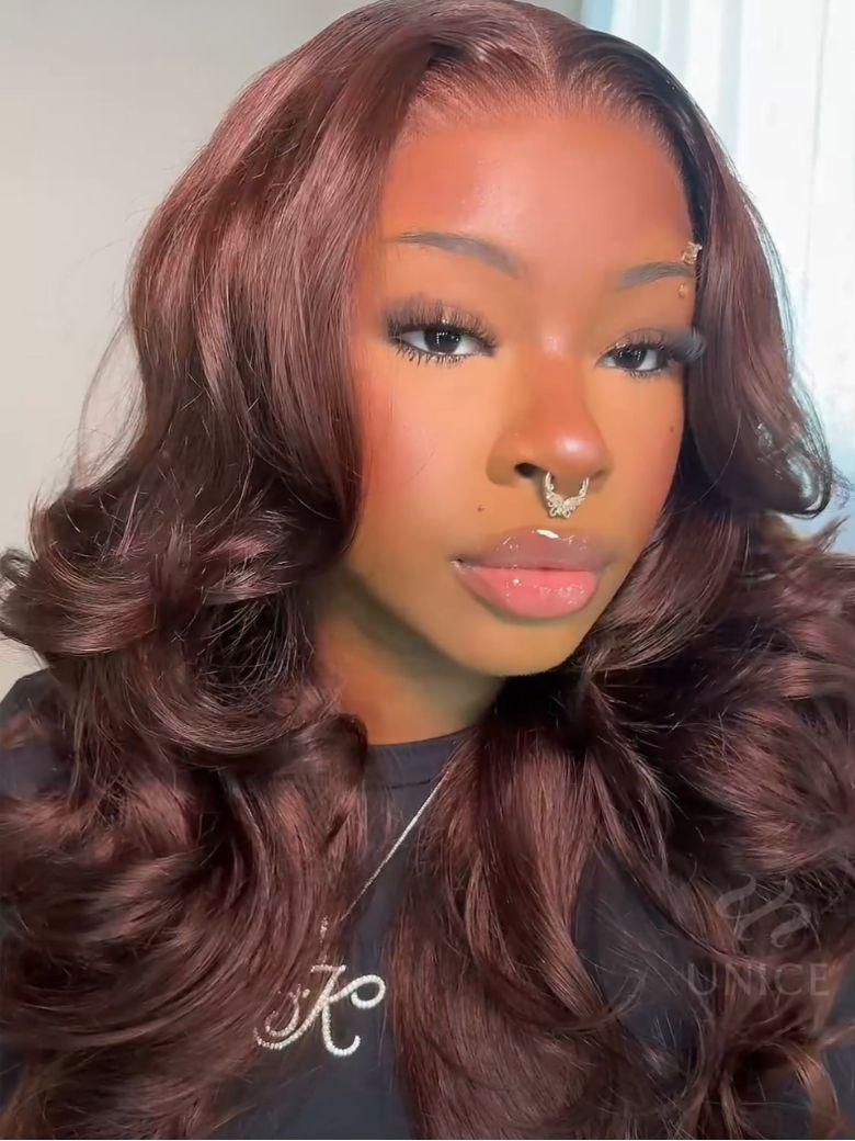 A model displays the UNice 24 Inch BOGO UNice Glueless Auburn Brown13x4 Pre-Everything Lace Frontal Loose, showing a model with long brown hair and a black shirt.