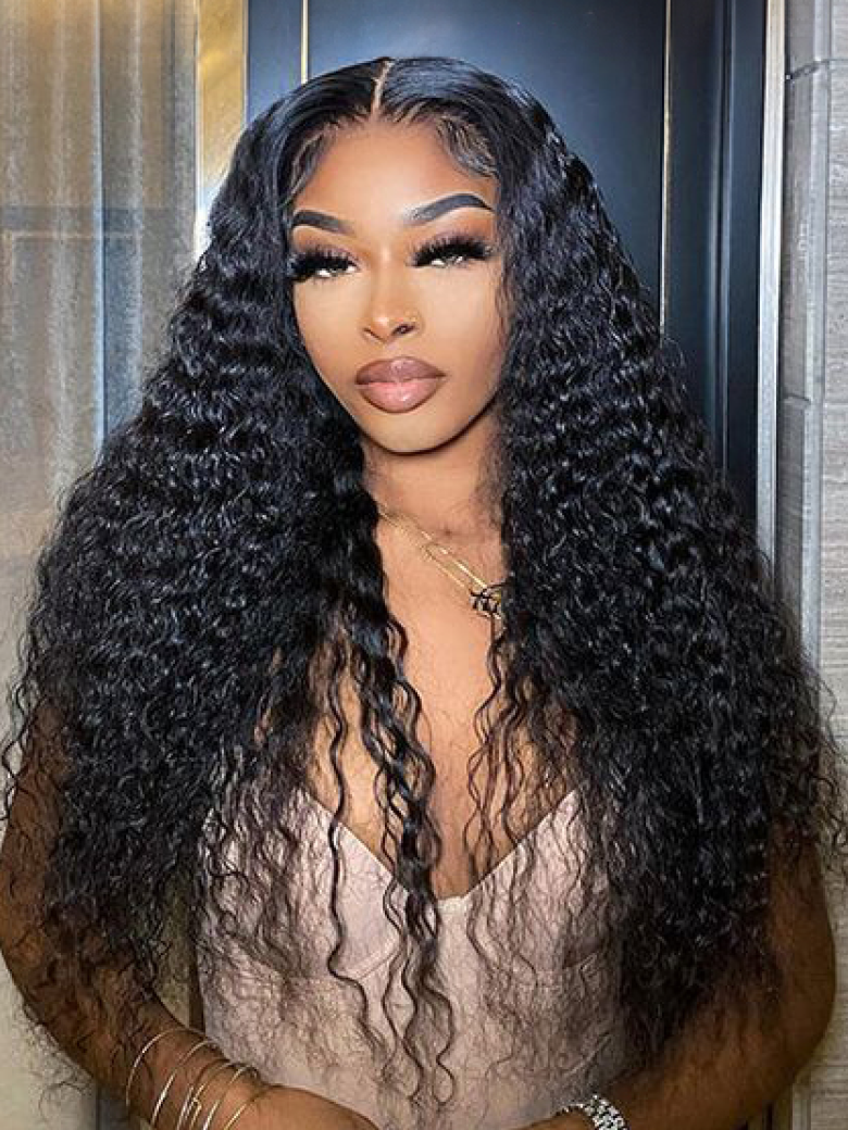 A model displays the UNice Middle Part Lace Kinky Curly wig 150% Density Natural Hairline Glueless wig, showing a model with long curly hair wearing a brown top.