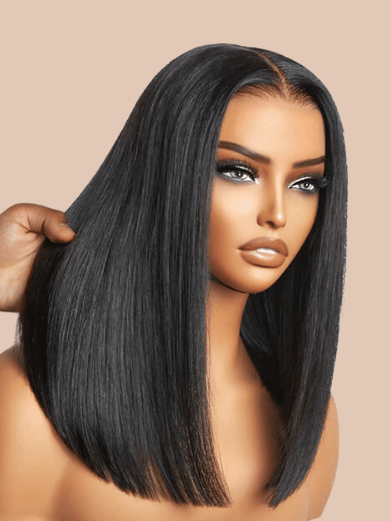 A model displays the UNice Invisi Drawstring Put On And Go Easy Daily Style Glueless Lace Bleached Knots wig, showing a model with long black hair and glueless wear.