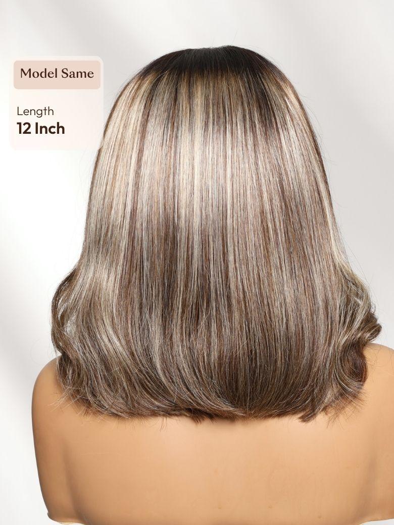 A model displays the UNice Bye Bye Slip 7x5 Lace Warm Brown with Beige Blonde Ribbon Highlights Layered wig, showing a model with a long, blonde haircut and highlight.