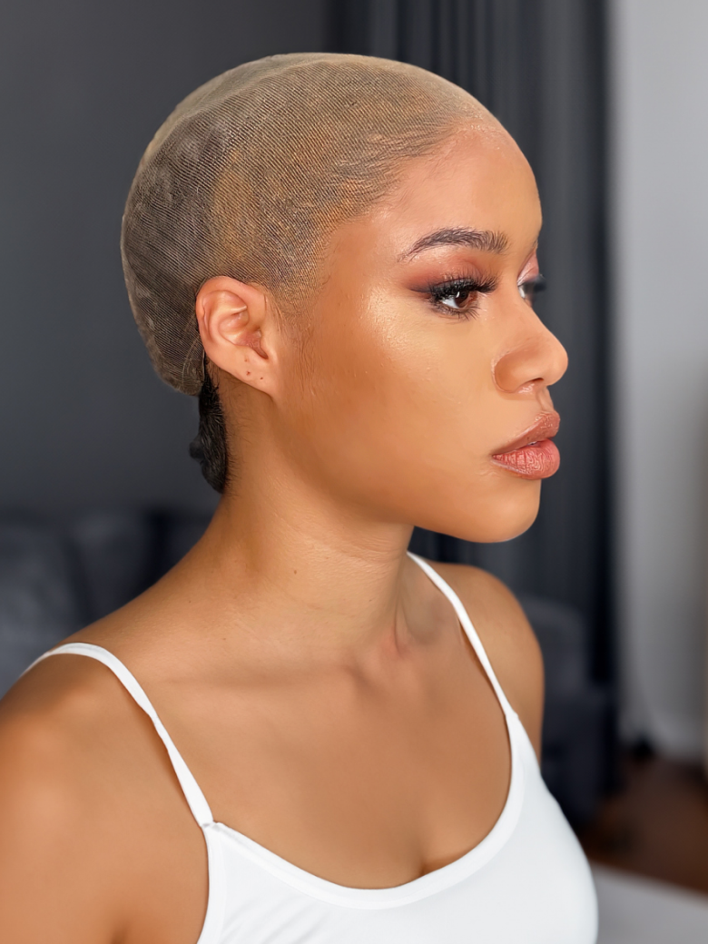 The UNice 4 Pieces Wig Caps Invisible HD Wig Cap Super Soft and Breathable UNICE visual image position 2 shows a model with a shaved hair style.
