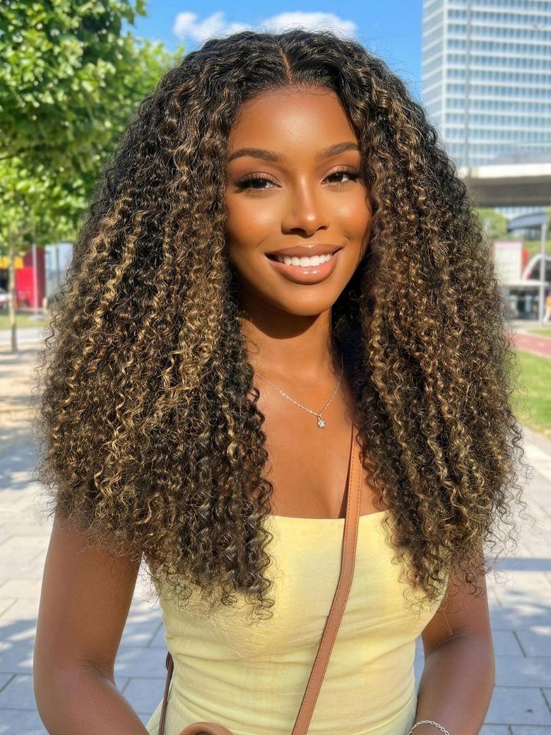 A model displays the UNice 7x5 Bye Bye Slip Lace Black with Blonde and Caramel Highlights Full Curly Wig, showing a model with long curly hair wearing a yellow dress.
