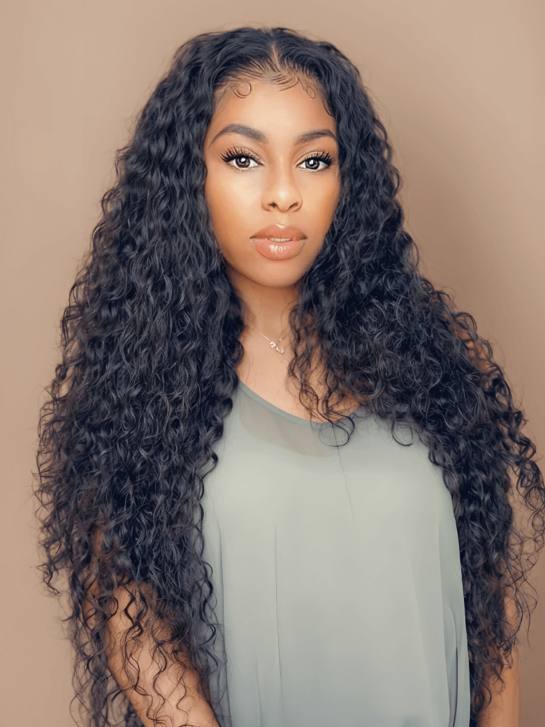 A model displays the Unice Deep Wave 4 Bundles with 5x5 Free Part HD Lace Closure Natural Black, showing a model with long curly hair and deep wave texture, natural.