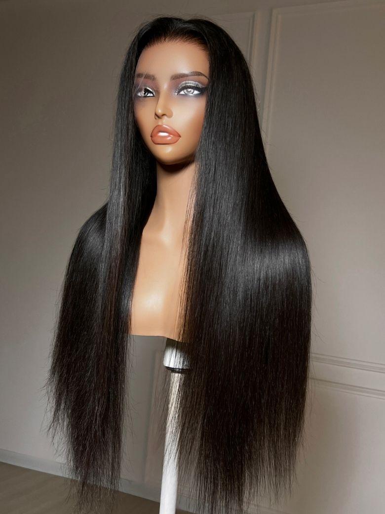 A model displays the UNice 360 HD Lace Pre-plucked Luxury Raw Virgin Hair Natural Black Straight Wig, showing a wig with long hair on a mann and straight texture.
