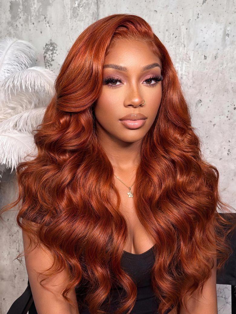 A model displays the UNice Bye Bye Slip 7x5 Lace Glueless Copper Auburn Body Wave Drawstring Wig with, showing a model with long red hair and a black top and body wave.