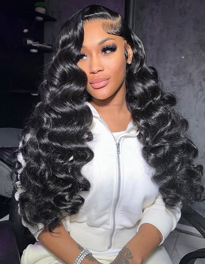 A model displays the UNice 13x4 Pre-Everything Wig Lace Frontal Natural Black Loose Deep Wave 150% Density, showing a model with long black hair and a white top and deep.