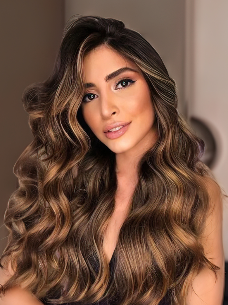 A model displays the UNice Balayage Highlight Human Hair Weave #FB30 Body Wave Hair Bundles 3 Bundle Deals, showing a model with long brown hair and a black dress.