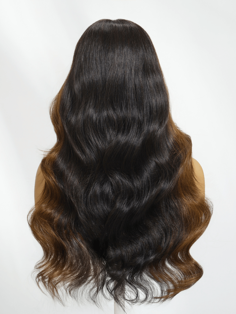 A model displays the UNice 7x5 Black Brown Money Piece Fluffy Loose Wave Curtain Bangs Wig, showing a model with long hair is wearing a wig and loose wave texture, 7x5.