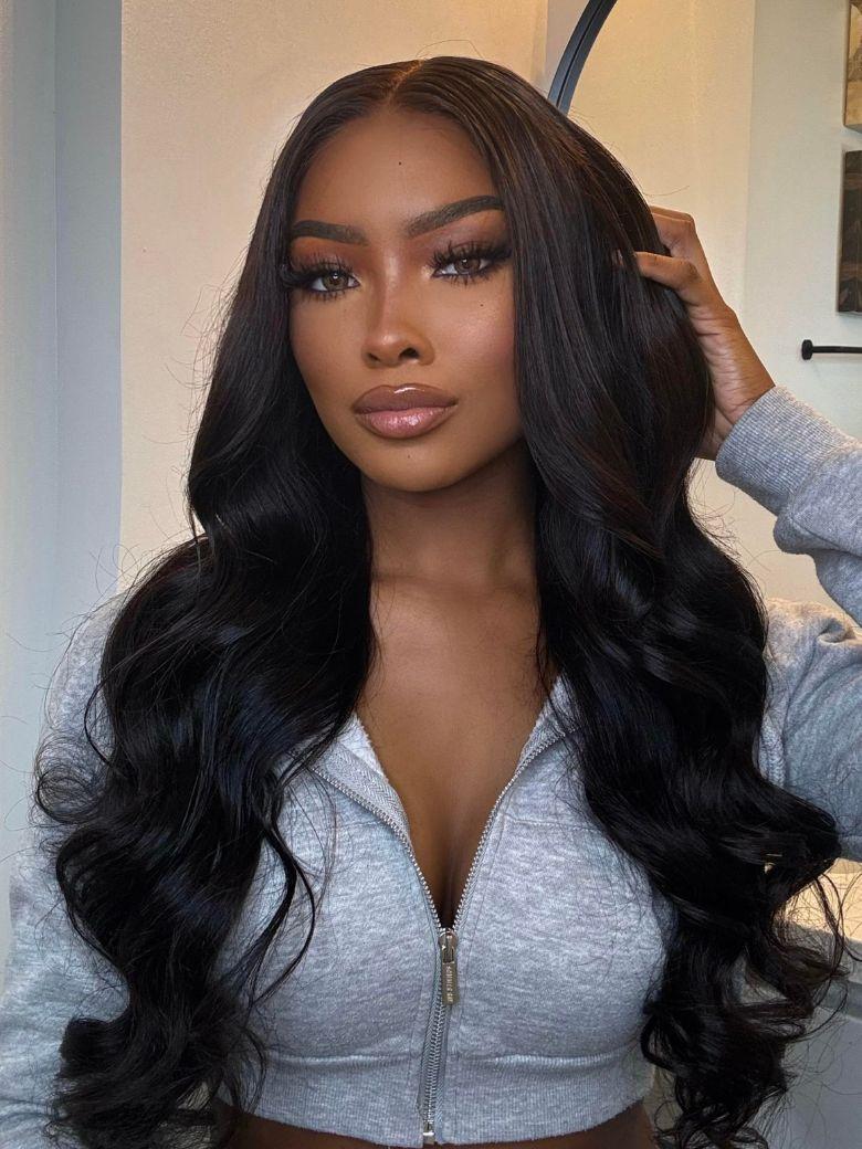 A model displays the UNice Invisi Drawstring UNice 13x4 Pre-Everything Transparent Lace & HD Lace Front wig, showing a model with long black hair wearing a grey hoodie.