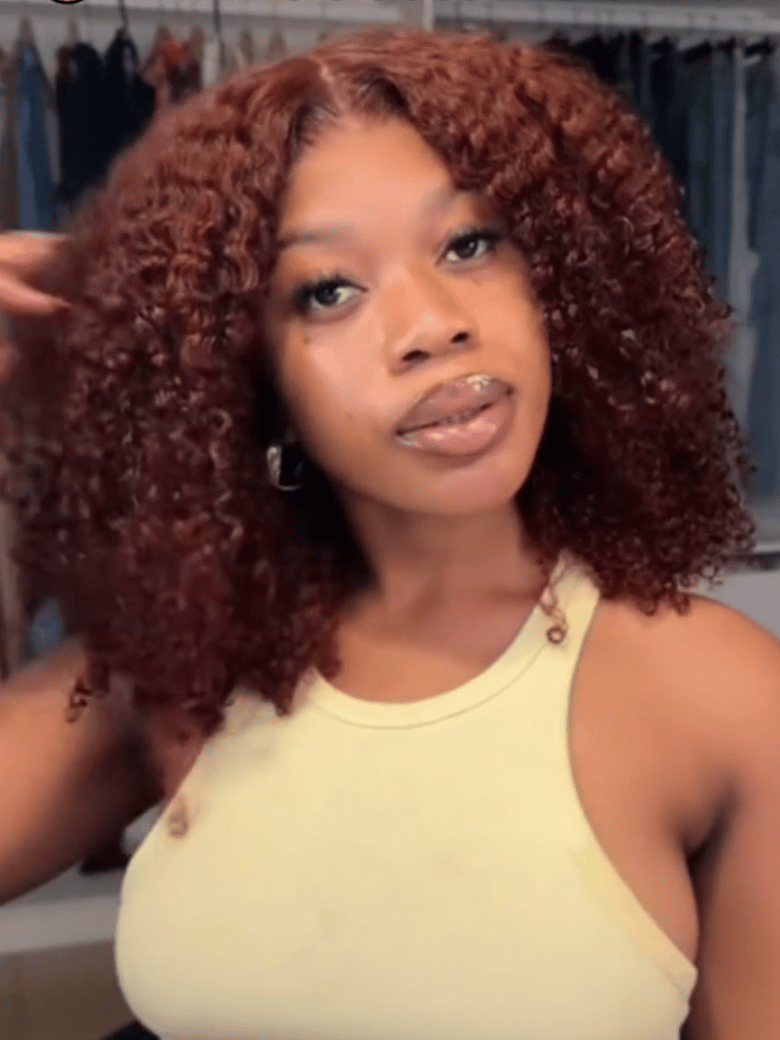 A model displays the UNice 7x5 Bye Bye Knots Wig Glueless Lace Sunset Reddish Brown Jerry Curly/ Afro, showing a model with curly hair is shown in a video and straight.