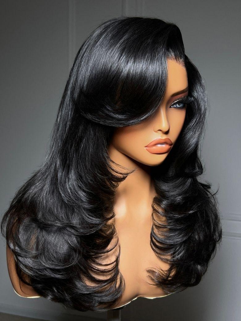 A model displays the UNice 200% Density 7x5 Bye Bye Slip Lace Feathered Blowout Wig with Face-Framing, showing a wig with long black hair and 7x5, lace finish.