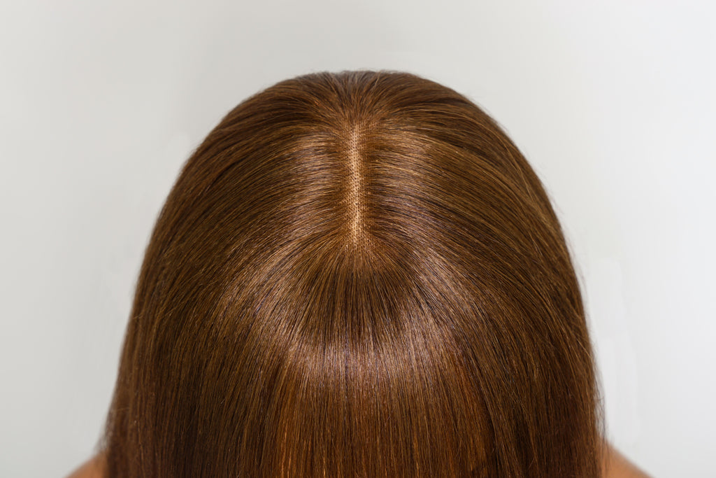 A model displays the UNice Yaki Straight human hair wig with Bangs Chocolate Brown Layered Cut 4x2, showing a model with long brown hair and straight texture, yaki.