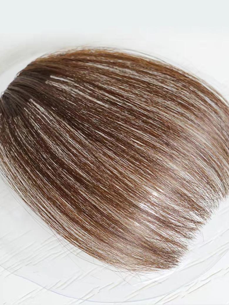 The UNice Hand-Made Dark Brown Straight Clip In Bangs product image shows a white plate with a brown hair on it and straight texture.
