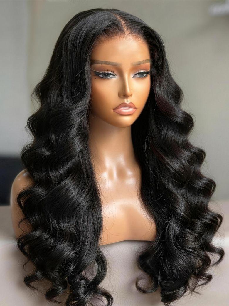 A model displays the UNice 7x5 Bye Bye Slip HD & Transparent Glueless Lace Body Wave Lace Front wig, showing a wig with long wavy hair and body wave texture, 7x5.