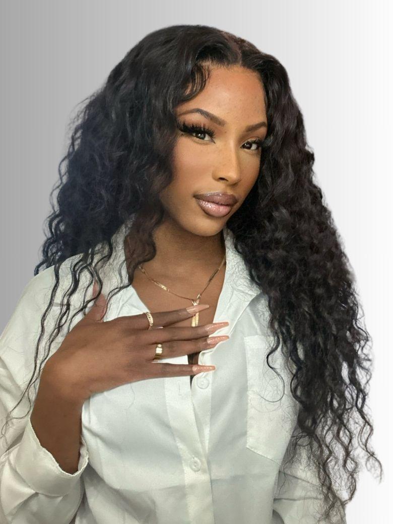 A model displays the UNice Bye Bye Knots Wig 7x5 Pre Cut Lace Bouncy Water Wave Flexible Cap Size, showing a model with long curly hair wearing a white shirt and water.