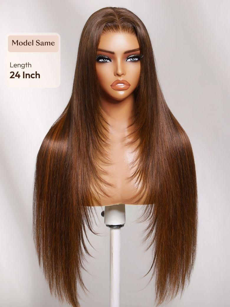 A model displays the UNice 7x5 Bye Bye Slip Lace Rich Brown with Golden Copper Highlights Layered wig, showing a wig with long brown hair and bangs and straight texture.