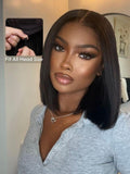 The UNice Black Yaki Bob 7x5 Bye Bye Knots Drawstring Wig Glueless Bleached Knots Wig visual image position 3 shows a model with long hair and a grey sweater | visible.
