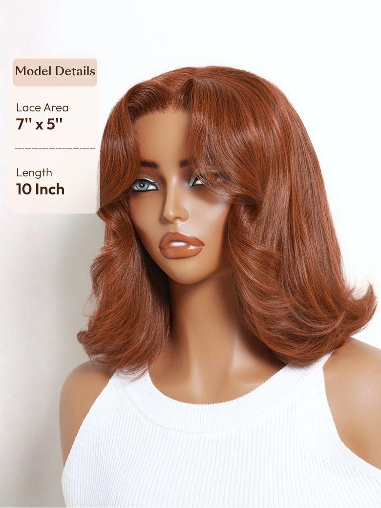 A model displays the UNice Bye Bye Slip 7x5 Lace Warm Brown with Beige Blonde Ribbon Highlights Layered wig, showing a model with blonde hair and a black top.