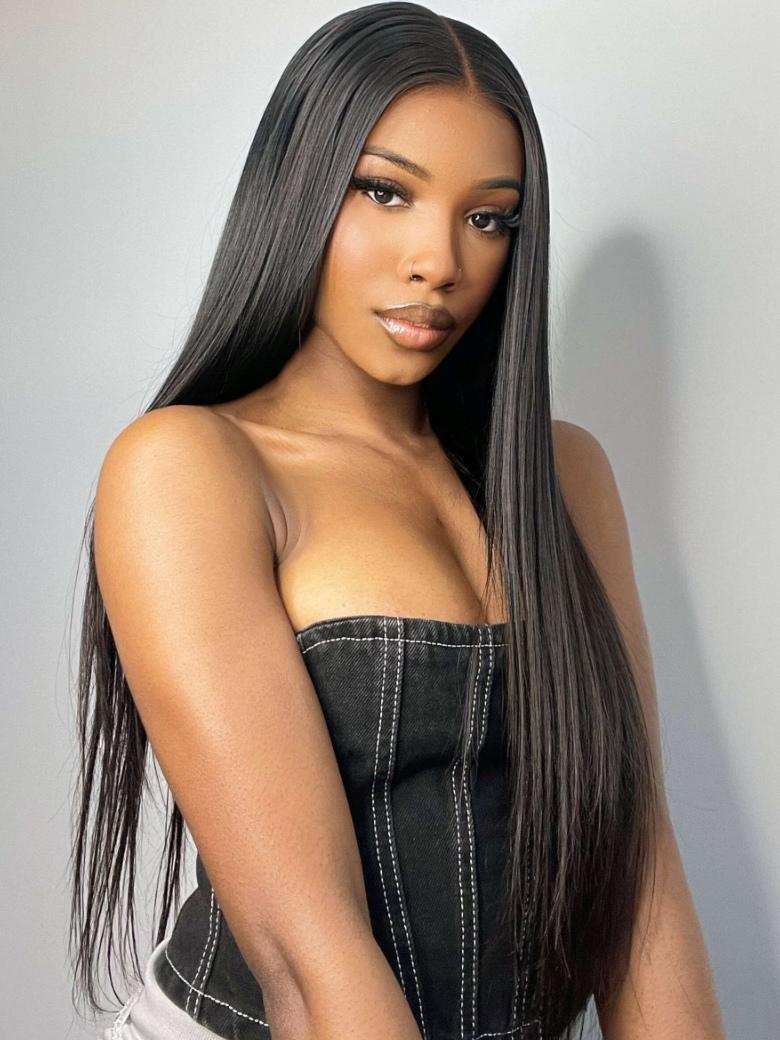 A model displays the UNice Straight Middle Part Lace Wig Pre Plucked 150% Density Perfect For Work Or Play, showing a model with long black hair wearing a black top.