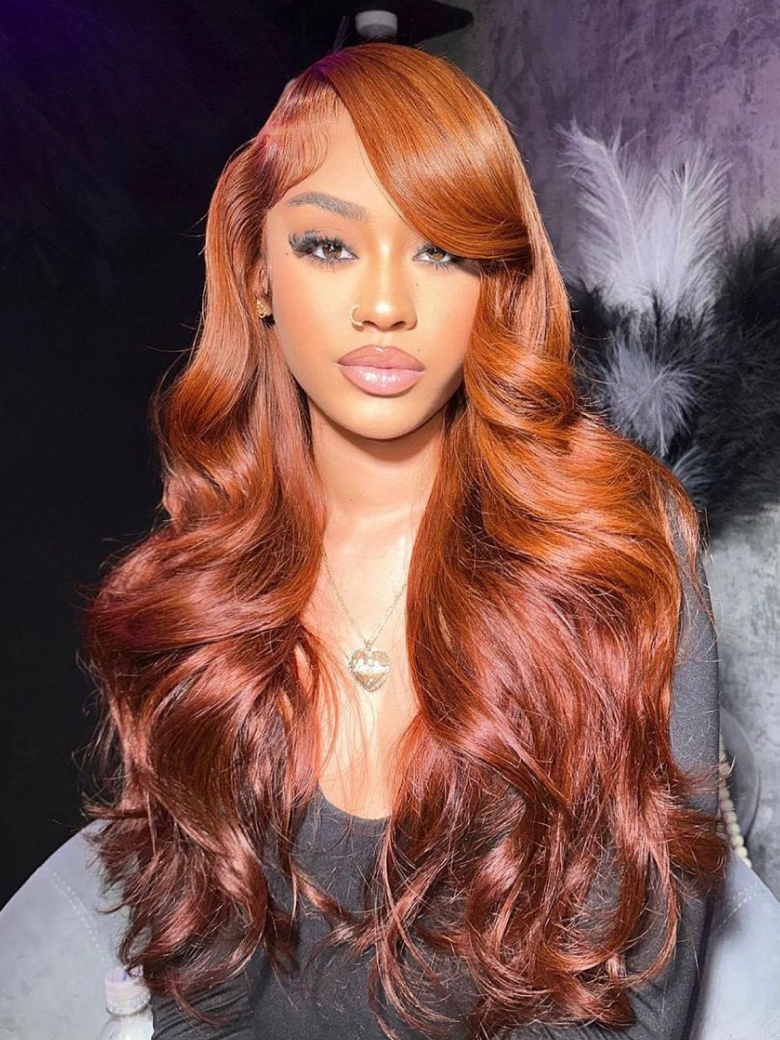 A model displays the UNice 7x5 Bye Bye Knots Red Orange Highlights Lace Wig with Face Framing Layers, showing a model with long red hair wearing a wig and loose wave.