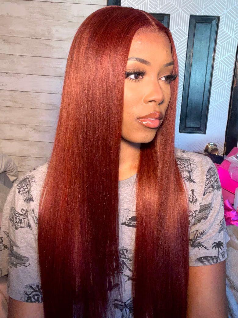 A model displays the UNICE $129 Surprise Box Win 13x4 Lace 200% Density Wig Value $299-$399, showing a model with long red hair and 13x4, lace finish.