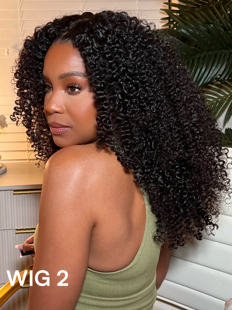 A model displays the UNice 22" Natural Lace Black Yaki V Part Wig Or 24" New V Part Kinky Curly Wig, showing a model with curly hair in a kitchen and yaki texture, kinky.