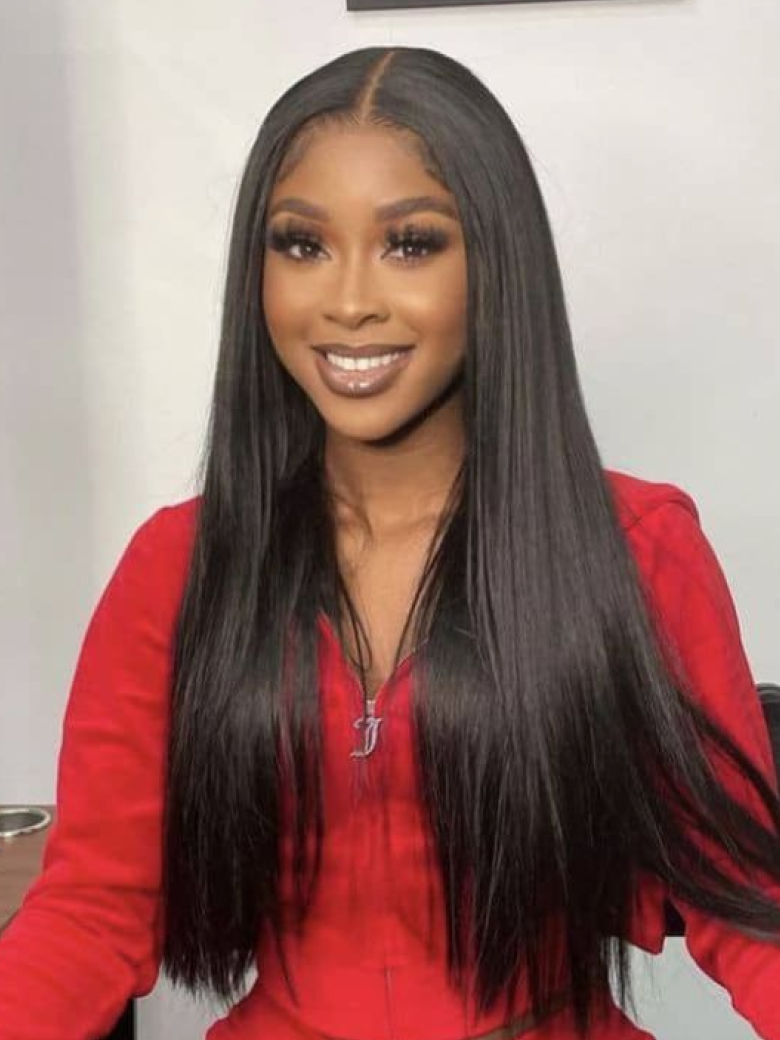 A model displays the UNice Straight Hair Lace Wig Pre-plucked 150% Density 4x0.75 Lace Part Wig, showing a model with long black hair sitting at a desk and straight.