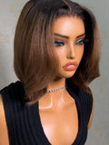 A model displays the UNice Bye Bye Slip 7x5 Lace Warm Brown with Beige Blonde Ribbon Highlights Layered wig, showing a model with blonde hair and a black top sitting.