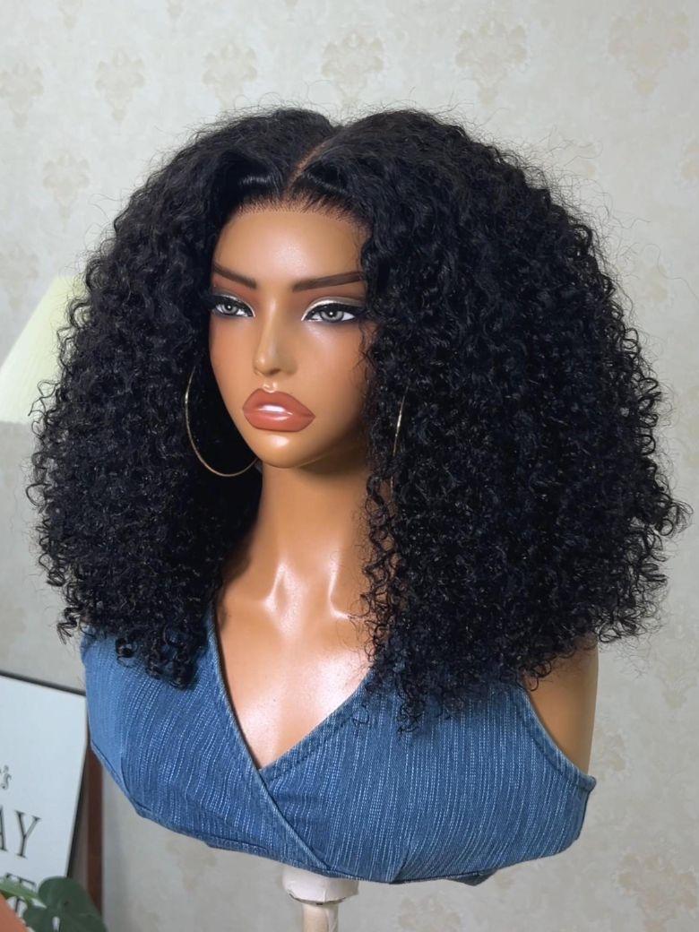 A model displays the UNice Bye Bye Slip 7x5 Lace Warm Brown with Beige Blonde Ribbon Highlights Layered wig, showing a model with blonde hair and a black top sitting.
