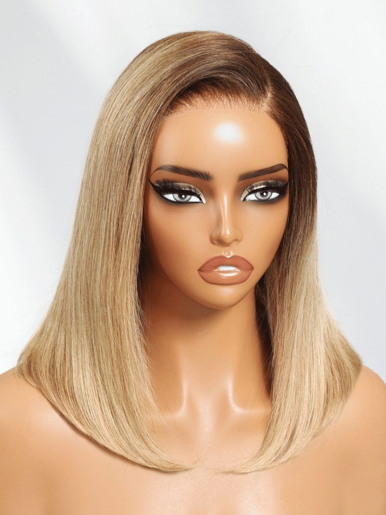The UNice Bye Bye Slip 7x5 Lace Blonde with Brown Roots Side Part Blunt Bob Drawstring wig product image shows a manne with blonde hair and black eyes and 7x5, lace.