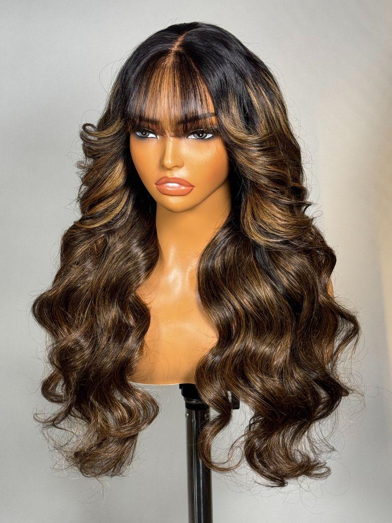 The UNice 7x5 Bye Bye Knots & 13x4 Pre-Everything Lace Frontal Balayage Highlights product image shows a wig with long wavy hair and bangs and loose wave texture.
