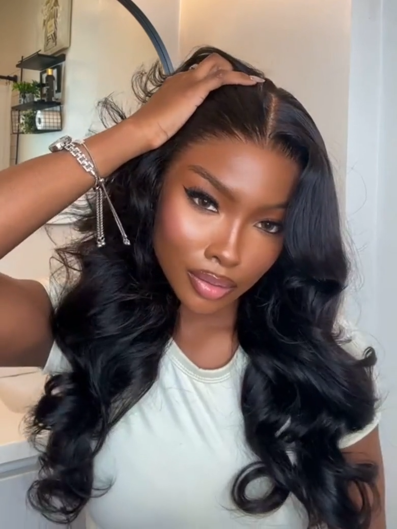 A model displays the UNice 20"-24" UNice 13x4 Pre-Everything HD Lace & Transparent Lace Front 3D Body wig, showing a model with long hair in a white shirt and body wave.