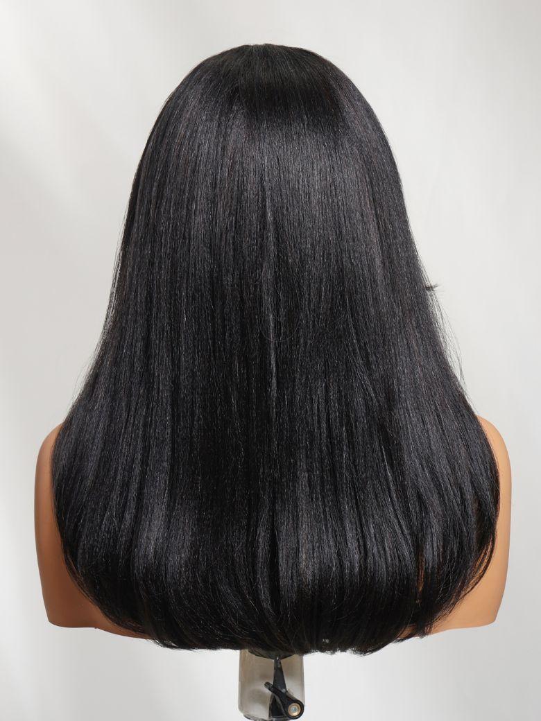 A model displays the UNice Pre Side-Part Yaki Straight Wig with Blowout Feathered Layers 7x5 Bye Bye Slip Wig, showing a black wig with long hair and straight texture.