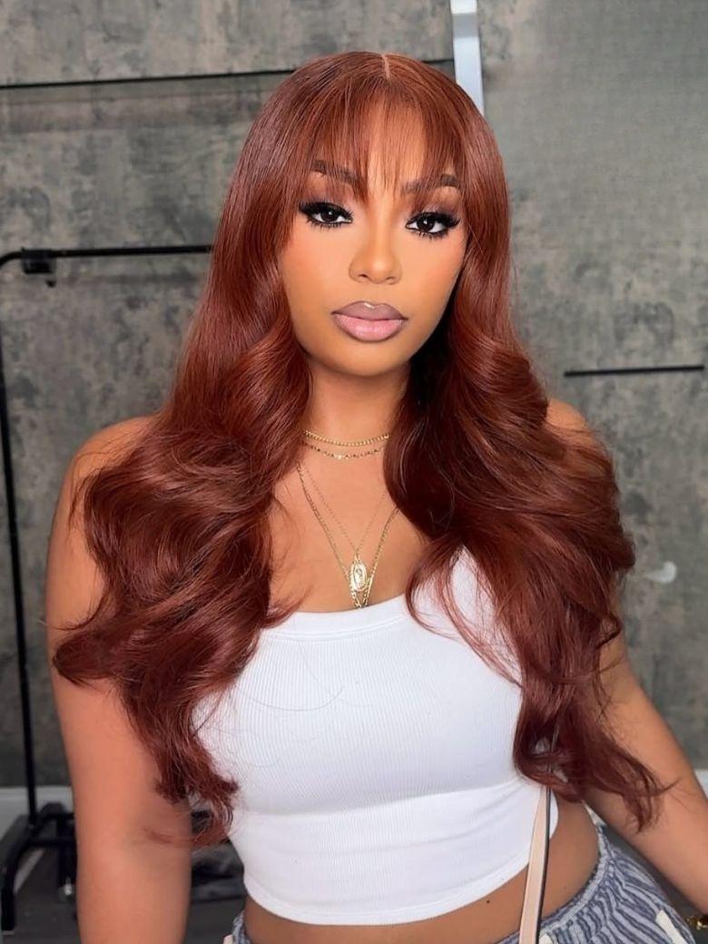 A model displays the UNice Ins Only 7x5 Bye Bye Knots Reddish Brown Kinky Curly & Straight & 13x4 wig, showing a model with long red hair wearing a white top and loose.