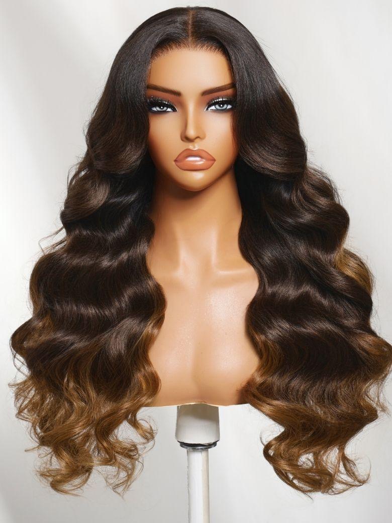 A model displays the UNice 13x4 Bye Bye Slip Lace Frontal Dark to Brown Ombre with Caramel Blonde Ends, showing a wig with long wavy hair and body wave texture, yaki.