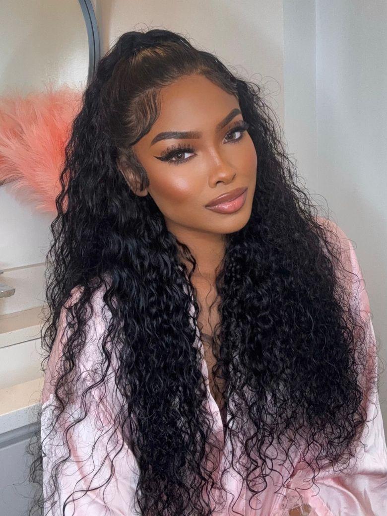A model displays the UNice 7x5 Bye Bye Knots & 13x4 Pre-Everything Lace Frontal Natural Black Water Wave, showing a model with long curly hair wearing a pink robe.