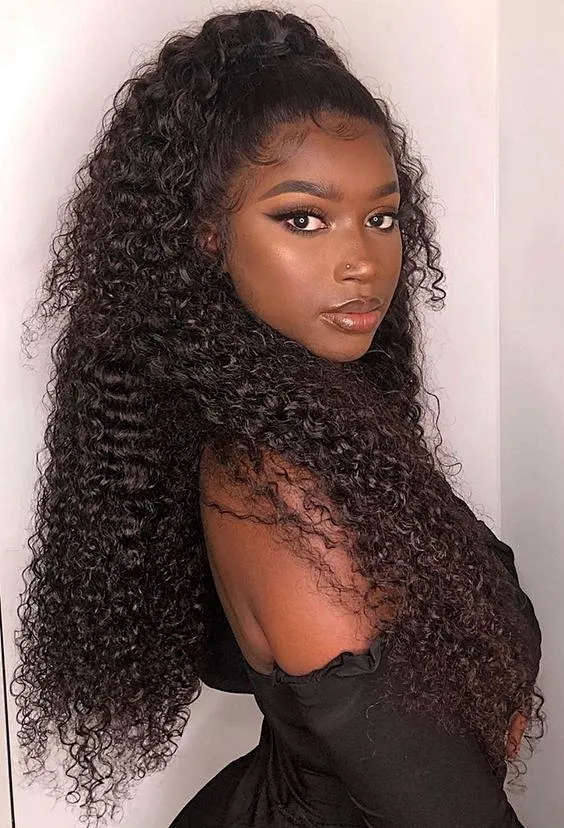 A model displays the UNice 13x4 Pre-Everything Lace Frontal Wig Kinky Curly Wig With Bleached Invisible Knots, showing a model with long curly hair wearing a black dress.