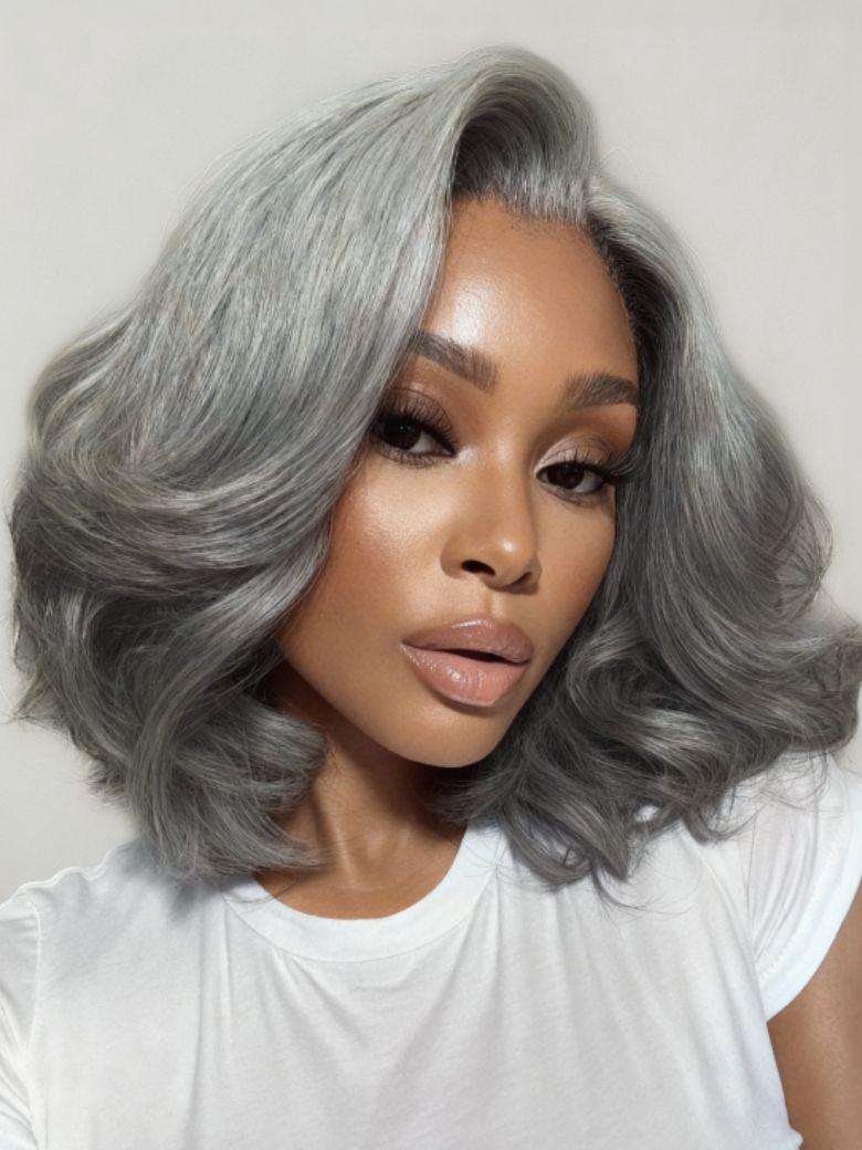 A model displays the UNice Boss-Vibe Salt and Pepper Blowout Layered Bob Glueless Wig 6.5x1.5 Side Part, showing a model with grey hair and a white shirt and 5x1.