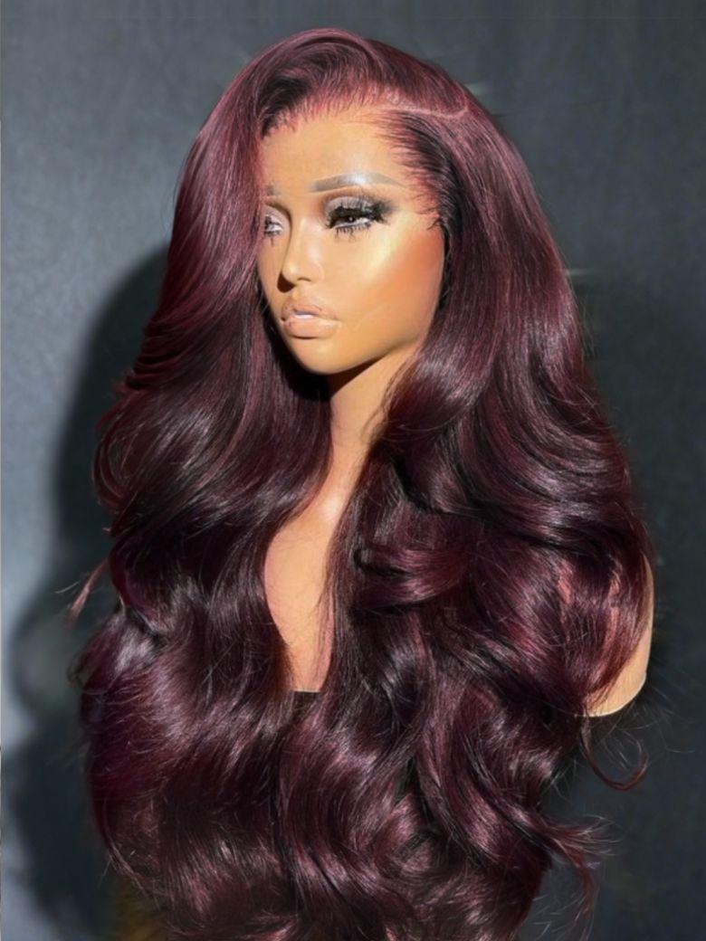 A model displays the UNice Invisi Drawstring 13x4 Pre-Everything Lace Purple Black Cherry Loose Wave wig, showing a wig with long wavy hair and a burgundy wig and loose.